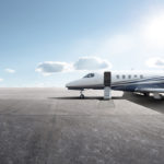 Business jet parked on runway during COVID-19