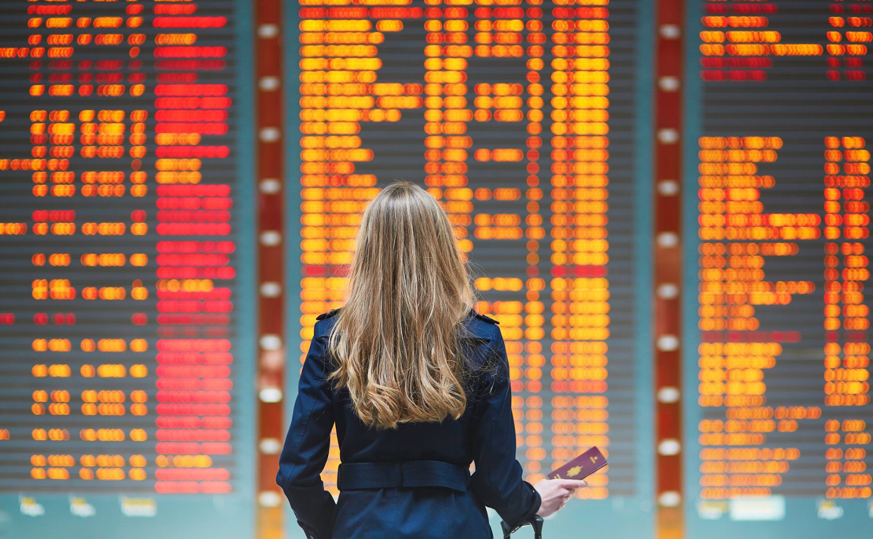 passenger in front of FIDs board