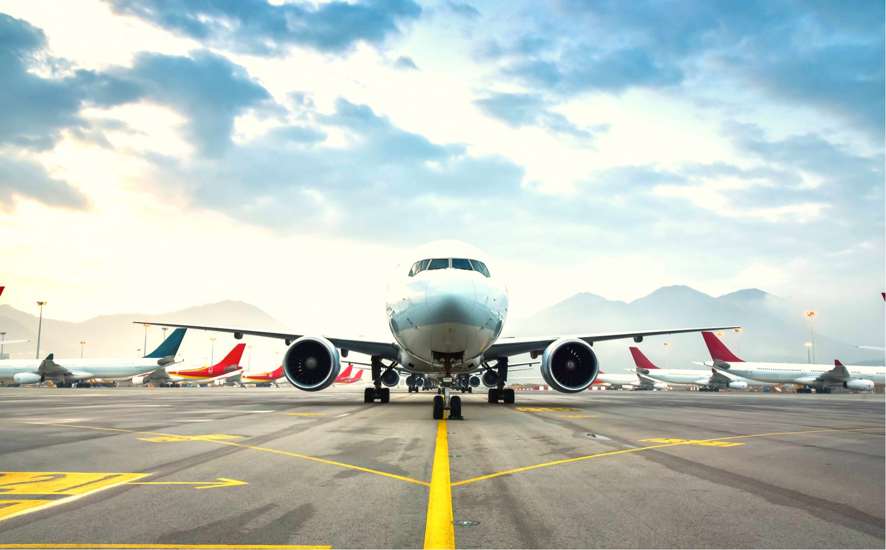 Airplane on runway with fleet