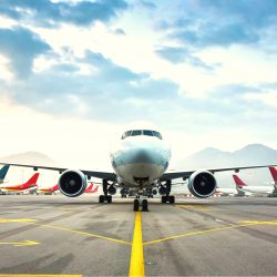Airplane on runway with fleet