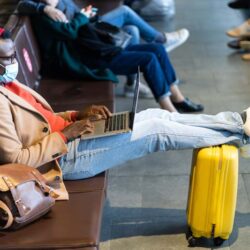 Traveler in mask waiting to board